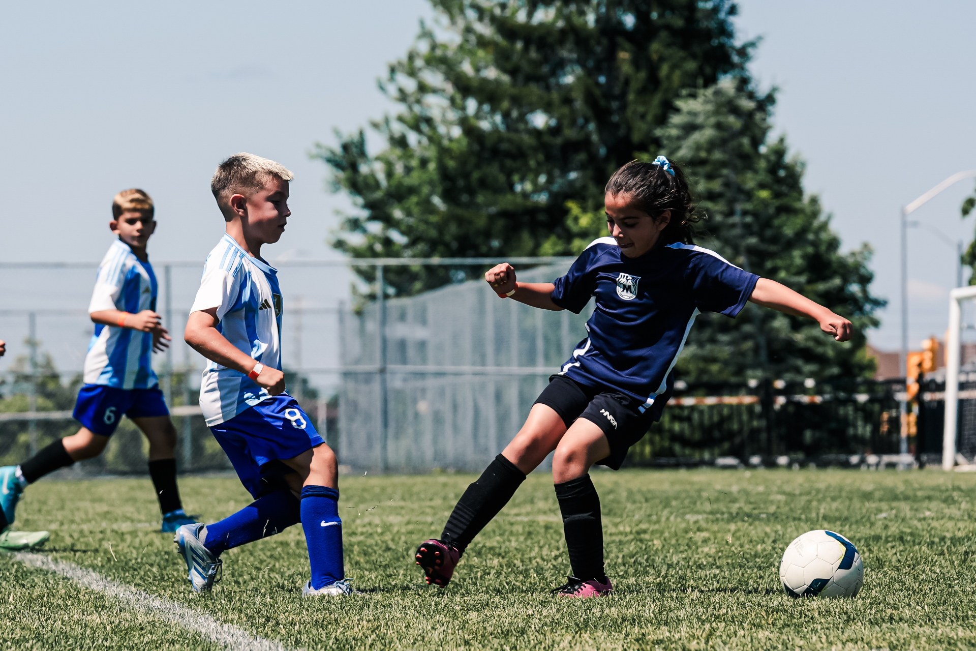 Rep player striking the ball during a competitive outdoor game